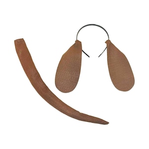 May include: A brown dog costume set consisting of a thin black headband with two long, rounded brown fabric ears attached to the sides, and a separate long, curved brown fabric tail with a textured surface finish.