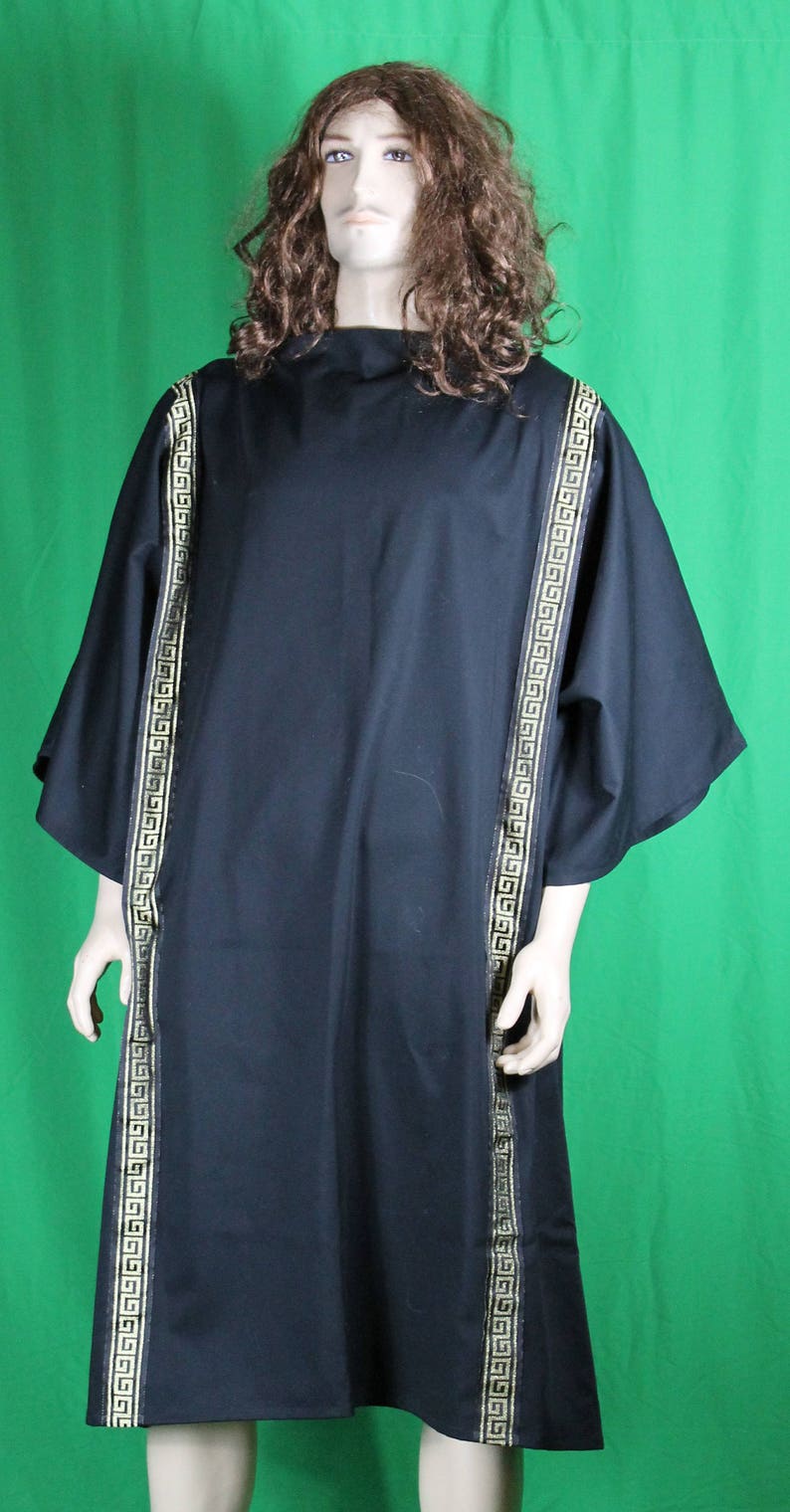 May include: A black tunic with gold trim, featuring a geometric pattern. The tunic has a simple, loose fit and a round neckline.