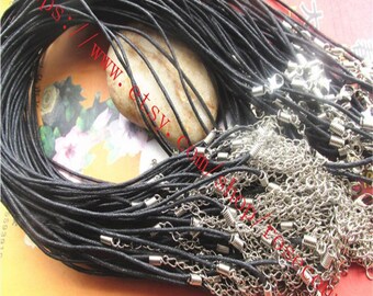 May include: A bulk lot of black waxed cotton cord necklaces with silver-toned lobster clasps and jump rings.