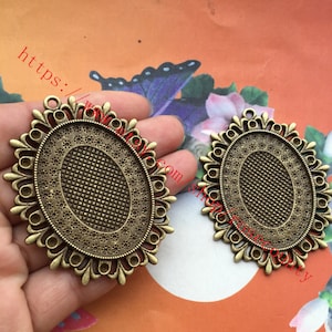 Grande - All'ingrosso 20 pezzi di vassoi con lunetta ovale in bronzo anticato (la dimensione del cabochon è 40x30 mm) che imposta i risultati del ciondolo