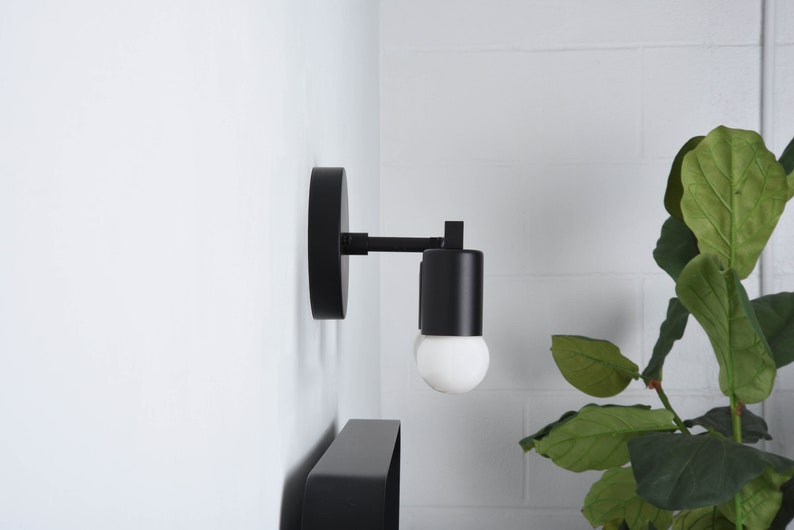 3 Light Mid Century Minimalist Wall Sconce Avon in Matte Black by Illuminate Vintage Shown In Side Profile View