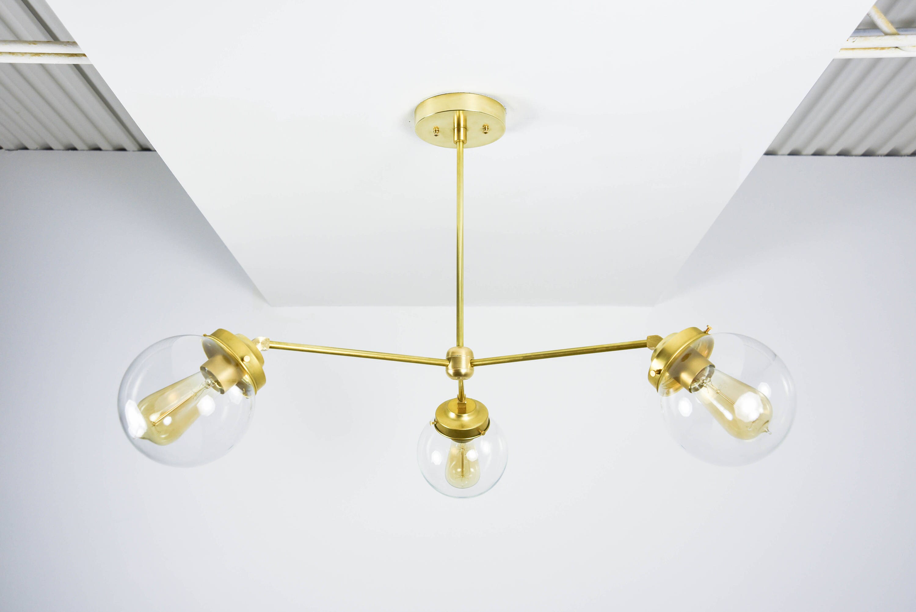 Orlando Chandelier Raw Brass Mid Century Industrial Modern Orlando Chandelier Raw Brass Mid Century Industrial Modern Sputnik Pinwheel 3 Arm Clear Globe Large Hanging Ul Listed