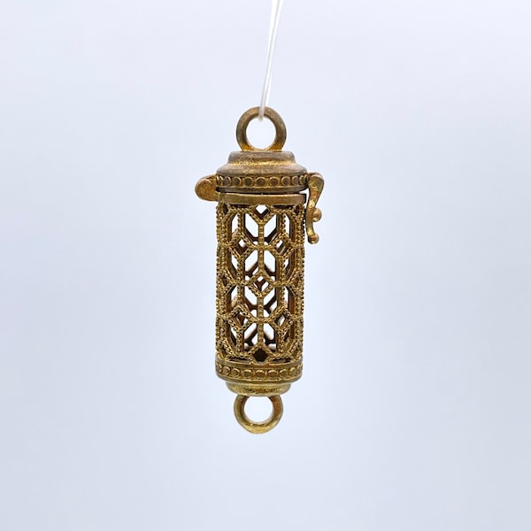 Solid brass cage pendant: color may range from copper to bronze. Not polished or treated. Cylinder shape. Good for stones (Bead not include)