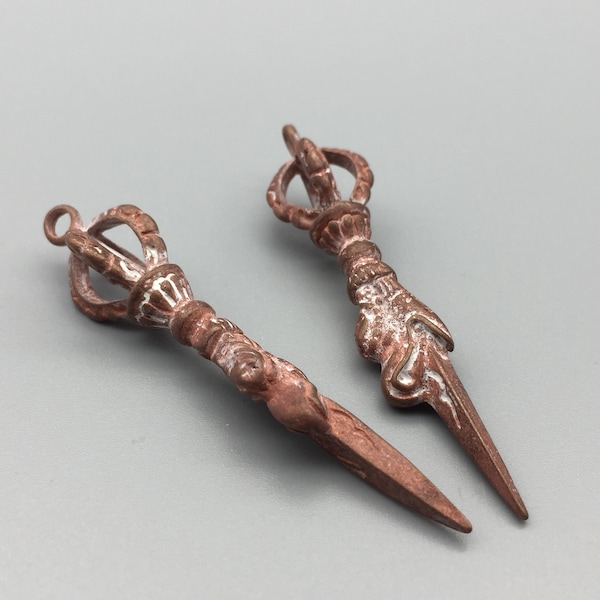 2 pc solid large brass/copper religious Buddhist apparatus: Vajry Pestle pendants, 2 1/2 x 1/2 inch, nice details. Not polished or treated.