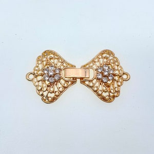 1 strand watch buckle /fold over clasp. (WB43) Silver/Gold plated metal with few rhinestones, Good for necklace or bracelet. New Arrival!