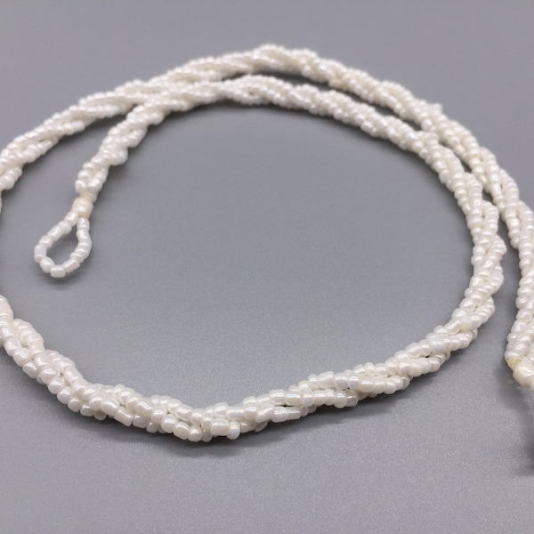 White seed bead necklace, 3 strands twisted, 18 inches with mother of pearl shell button and loop as closure. Sample not include