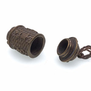 Solid brass Tibetan Buddhism prayer wheel pendant, color may range from copper to bronze. Cap screws off, 1 1/2 x 1/2&quot;, Polished/No Polished