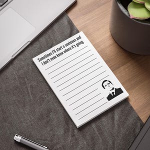 May include: White notepad with lined pages and the text "Sometimes I'll start a sentence and I don't even know where it's going." A black and white image of a man is in the bottom right corner. The notepad is on a wooden desk.