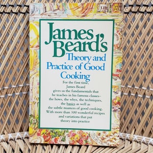 May include: A hardcover cookbook titled "James Beard's Theory and Practice of Good Cooking" with a green and white border. The book's cover features the title in large green letters and colorful illustrations.