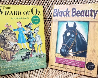 Libros de tapa dura de Random House Books de los años 50: El mago de Oz y Black Beauty.