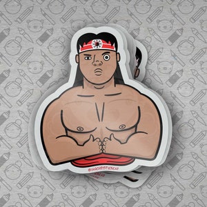 May include: A sticker featuring a cartoon illustration of a muscular person with a red headband and a black and white symbol on their forehead. The person is wearing a red shirt and has a determined expression on their face. The sticker has the text "@IAMCHRISTIEBEAR" at the bottom.