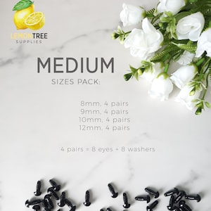 May include: A pack of black plastic safety eyes for crafts. The pack includes four pairs of eyes in each of the following sizes: 8mm, 9mm, 10mm, and 12mm. The text "MEDIUM SIZES PACK: 8mm. 4 pairs 9mm. 4 pairs 10mm. 4 pairs 12mm. 4 pairs 4 pairs = 8 eyes + 8 washers" is printed on a white background.