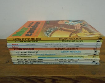 Set of 11 Hardcover Asterix Books.   Mostly in VG condition- Mixed ages