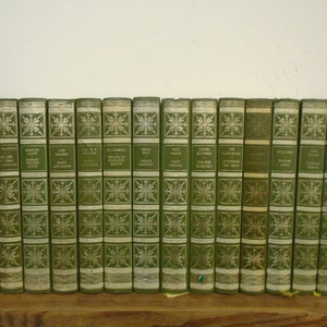 Set of 14 Women Who Made History Books. Vinyl covered books by Heron Books.