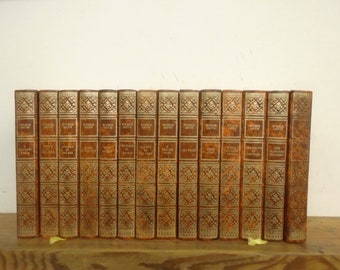 Set of 14 Wilbur Smith Vinyl covered books by Heron Books.