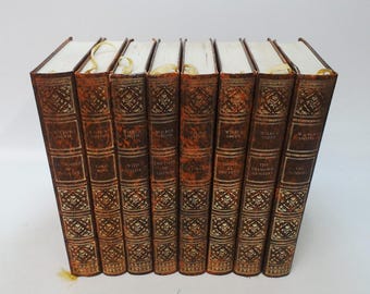 Set of 8 Wilbur Smith Vinyl covered books by Heron Books.