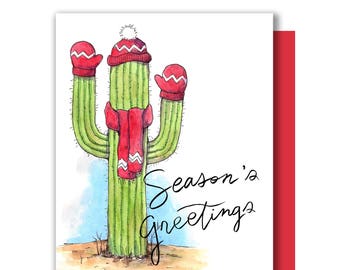 May include: A watercolor illustration of a cactus wearing a red hat and scarf with the text "Season's Greetings".