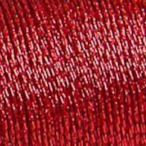 May include: Close-up of a spool of red metallic thread. The thread is tightly wound, showing a textured, reflective surface. The color is a vibrant, solid red, with a slight sheen. The thread appears to be for crafting or sewing projects.