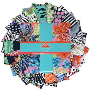 May include: A selection of fabric squares featuring diverse floral and abstract designs in vivid colours including pink, orange, blue, and green. The squares are arranged in a circular pattern, secured by a turquoise band. The text "Kaffe Fassett Collective" is visible.