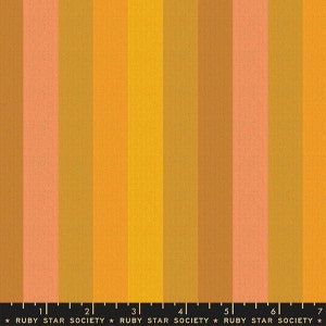 May include: A fabric swatch with vertical stripes in shades of orange, yellow, and brown. The fabric is labelled with the text "RUBY STAR SOCIETY".
