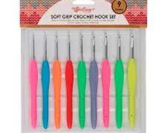 May include: A set of nine colorful crochet hooks with soft grip handles. The hooks are arranged in a clear plastic case with the text "Soft Grip Crochet Hook Set" printed on the front.