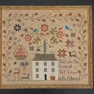 May include: Cross-stitch pattern featuring a house with a tree and birds, surrounded by a floral border. The text "'Til over the Ground Yet Grace doth abound" is stitched below the house.