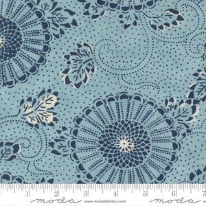 May include: Blue and white floral fabric with a repeating pattern of stylised flowers and leaves. The fabric has a subtle dotted texture.