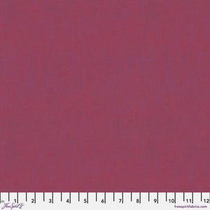 Peut inclure: Tissu uni bordeaux avec une texture subtile. Le tissu est d'une nuance profonde et riche de rouge-violet, adapté à divers projets de couture et d'artisanat. Une règle est présente en bas pour l'échelle.