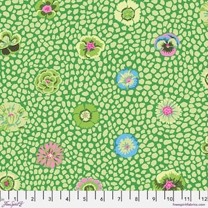 May include: A fabric with a repeating floral pattern. The design features various flowers in shades of green, pink, and blue, set against a light green background with a speckled texture. The fabric is measured in inches.