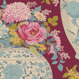 May include: Two white ceramic vases with blue and gold floral designs, filled with pink, white and yellow flowers against a burgundy background.