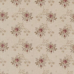 May include: A beige fabric with a repeating floral pattern. The design features clusters of burgundy roses with green leaves and delicate brown stems. Small, dotted accents and floral sprigs complete the vintage-inspired textile.
