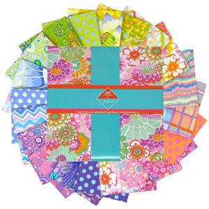 May include: A selection of patterned fabric squares in a circular arrangement. The fabrics display floral, polka dot, and geometric patterns in pink, green, blue, and orange hues. A turquoise ribbon is wrapped around the centre, with text that reads "Kaffe Fassett Collective".