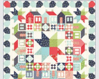 May include: A quilt pattern called "Summer­ville" featuring a colorful design of houses, stars, and geometric shapes. The pattern is from Thimble Blossoms by Camille Roskelley and is number 192.