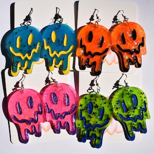 Drippy smiley face earrings - trippy bright glitter dangling earrings - blacklight and glow in the dark resin smile earrings