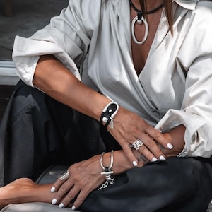 Bold unode50 style cuff bracelets, Equestrian bracelets, Silver-plated stirrup style bracelet with brown leather buckle clasp
