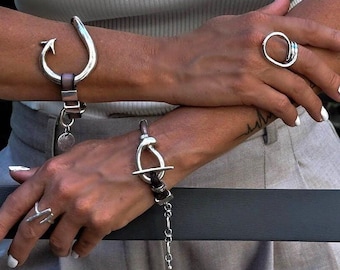 Bold metal and leather bracelets, Unisex edgy statement bracelets, Unode50 style cuff, Arrow and knot standout bracelets