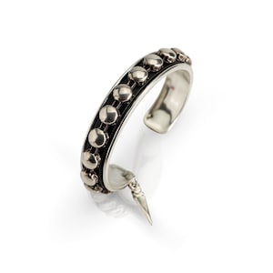 Antique Silver bangle with black leather and silver stud chain. Rock your wild side with this bangle!