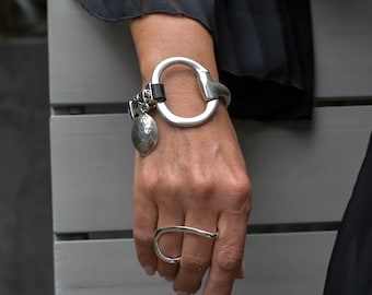 Unode50 style bracelet, Standout black leather and horsebit metal, Equestrian cuff bracelet