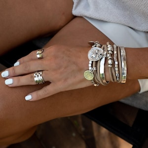 Suede boho bracelet with coins and metal cubes, ethnic four strand wrap around cuff with charms