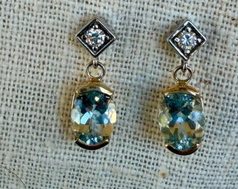 Aquamarine earrings with diamonds set in 2 tone 14k gold