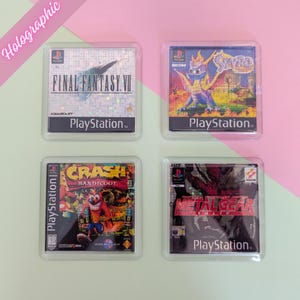 May include: Four square coasters featuring holographic images of classic Playstation game covers. The coasters feature the games Final Fantasy VII, Spyro the Dragon, Crash Bandicoot, and Metal Gear Solid.