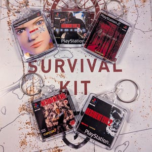 May include: Five clear plastic keychains featuring images of Resident Evil video game covers. The keychains display the PlayStation logo and the words "Survival Kit".
