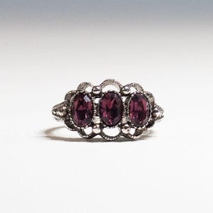 Signed Avon Purple Brilliance Ring Amethyst Silver Tone Ring 1975 Size 4 to 5.5 Adjustable Avon Fashion Accents 50 Years Old Excellent