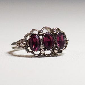 Vintage Signed Avon Purple Brilliance Ring Amethyst 3 Stone Silver Tone Ring 1975 Size 4.5 to 6 Adjustable Avon Fashion Accents Excellent