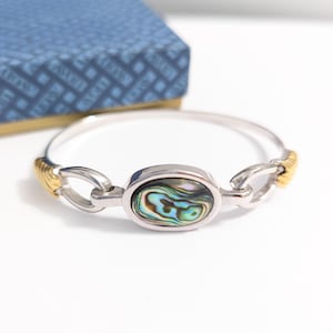 AVON ©1979 Pulsera rígida de concha de abulón en tono plata y oro de 6,5" con bisagra (NOS) 243