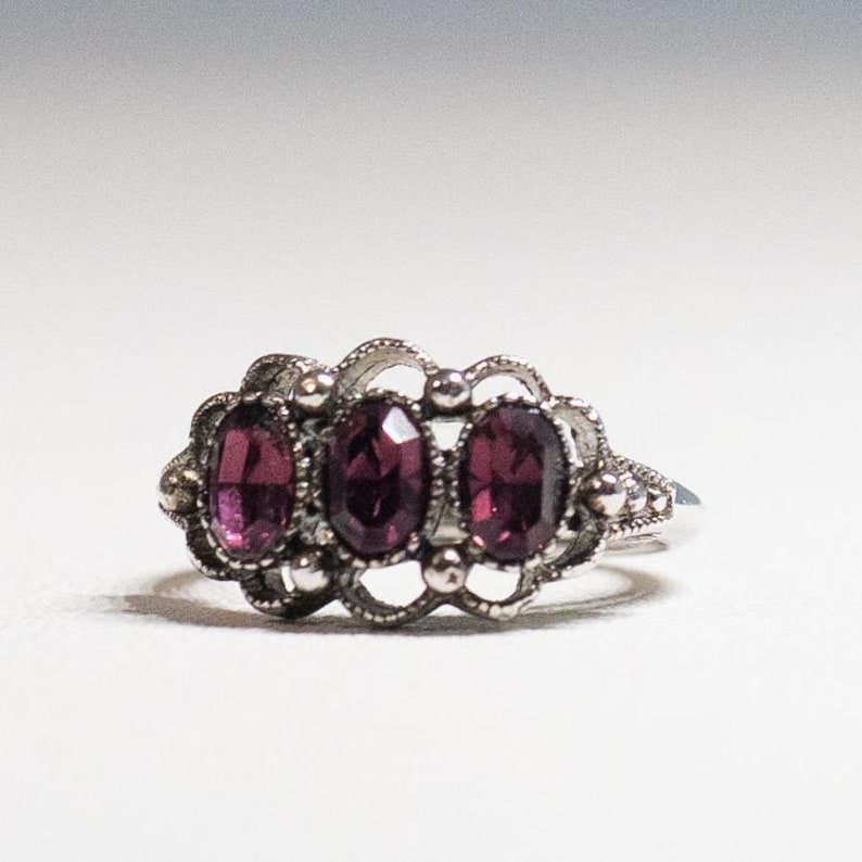 Signed Avon Purple Brilliance Ring Amethyst 3 Stone Silver Tone Ring 1975 Sz 4 to 5.5 Adjustable Avon Fashion Accents Excellent 50 Years Old