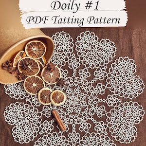 May include: A white doily with a delicate lace pattern, made using the tatting technique. The doily is laid out on a brown fabric surface, with dried orange slices and cinnamon sticks scattered around it. The text "Doyly #1 PDF Tatting Pattern" is visible at the top of the image.
