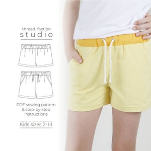 May include: A sewing pattern for kids' shorts. The pattern includes instructions for sizes 2-14. The image shows a line drawing of the shorts and a photo of a child wearing the shorts.