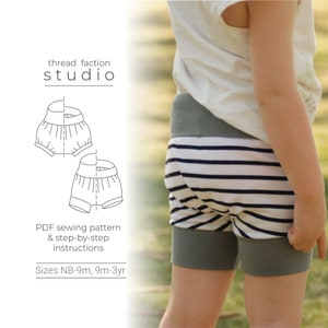 May include: A black and white line drawing of a pair of shorts for a child. The drawing is on a white background with the text "thread faction studio" and "PDF sewing pattern & step-by-step instructions" and "Sizes NB-9m, 9m-3yr".