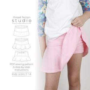 Può includere: Un cartamodello digitale per una gonna rosa con un orlo a balze. Il cartamodello è disponibile nelle taglie 2-14. Il testo "thread faction studio" è in alto nell'immagine.